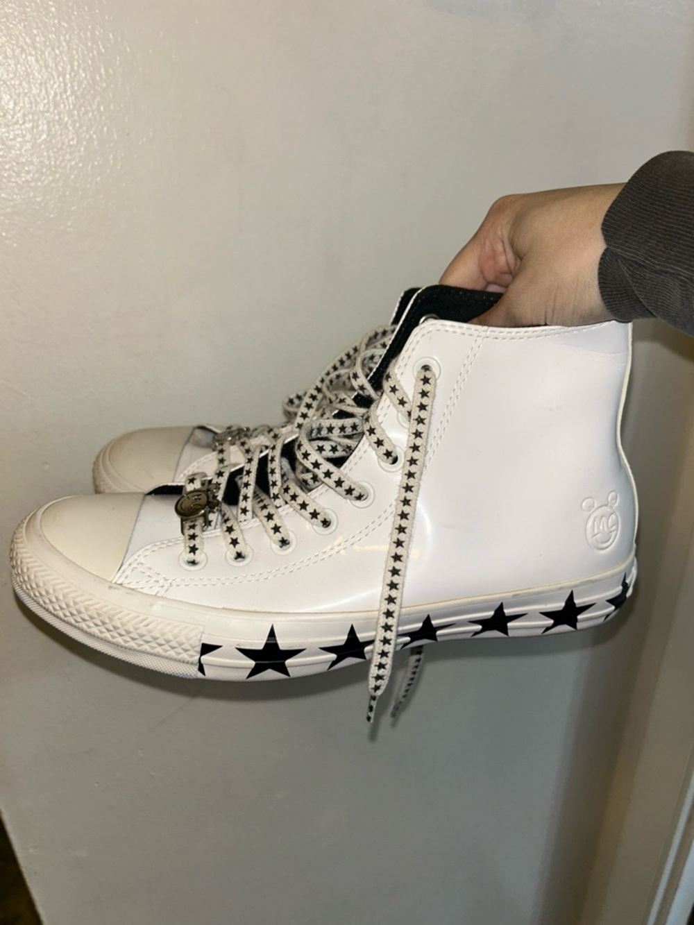 Converse x Miley Cyrus White High-Top Sneakers with Black Star Accents
